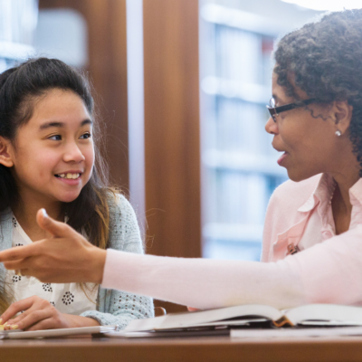 Teacher talking to student