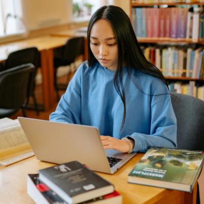 Student using laptop in the library